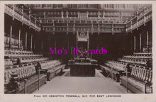 Load image into Gallery viewer, Vintage black and white photo of a large room with rows of chairs and a podium, labeled 'Mo's Postcards'.
