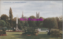 Load image into Gallery viewer, Vintage postcard of Leamington Spa with Jephson Gardens, featuring a monument and cathedral.