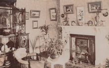 Load image into Gallery viewer, Vintage interior scene with a fireplace, furniture, and decorative items.