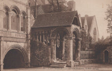 Load image into Gallery viewer, Historic stone building with arches and columns, likely a Norman structure, in a sepia tone.