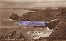 Load image into Gallery viewer, Sepia-toned image of a coastal scene with cliffs and a building.