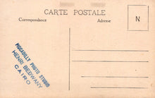 Load image into Gallery viewer, Back of a vintage postcard with text and a logo, featuring 'Piggadilly Photo Studio Henri Bedwany Cairo'.
