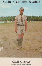 Load image into Gallery viewer, Scout in uniform standing in a field with 'Scouts of the World' and 'Costa Rica' text at the bottom.