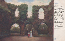 Load image into Gallery viewer, Ruins of Reading Abbey with two people standing in front, vintage postcard style.