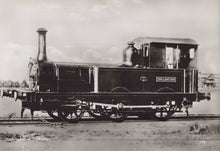 Load image into Gallery viewer, Vintage black and white photograph of a steam locomotive on a track.