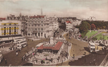 Load image into Gallery viewer, Vintage image of a city square with buildings, people, and vehicles.