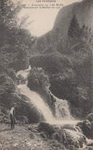 Load image into Gallery viewer, Vintage photograph of a waterfall in a mountainous area with a person standing nearby.