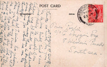 Load image into Gallery viewer, Vintage postcard with handwritten text and a red stamp on a beige background