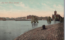 Load image into Gallery viewer, Vintage postcard of a waterfront scene with a dock and buildings in Cardiff, Wales.