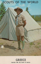 Load image into Gallery viewer, Scout standing in front of a tent with 'Scouts of the World' and 'Greece' text.
