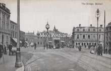 Load image into Gallery viewer, Vintage black and white photo of a town square with people, buildings, and a clock tower.