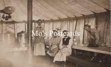 Load image into Gallery viewer, Vintage black and white photo of men inside a tent