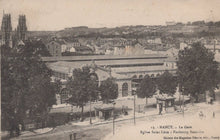 Load image into Gallery viewer, Vintage postcard of a train station in Nancy with trees and buildings in the background