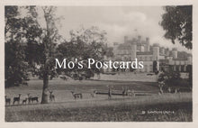 Load image into Gallery viewer, Vintage black and white postcard of a castle with deer in a park, featuring 'Mo's Postcards' text.