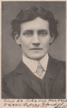 Load image into Gallery viewer, Black and white portrait of a young man in formal attire with text on the back.