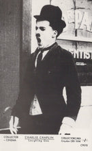 Load image into Gallery viewer, Black and white image of Charlie Chaplin with a top hat and bow tie, sitting on a bench.