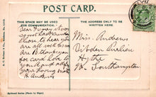 Load image into Gallery viewer, Vintage postcard with handwritten text and a stamp on a light brown background
