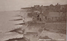 Load image into Gallery viewer, Vintage black and white photograph of coastal buildings and sea.