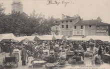 Load image into Gallery viewer, Vintage postcard of a market scene in Saint-Marcellin with people and tents.