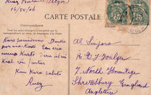 Load image into Gallery viewer, Vintage postcard with handwritten text and postage stamp, featuring a brown background.