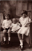 Load image into Gallery viewer, Ancestors Postcard - Three Children Sat on a Bench, Exeter Photographer SW16849