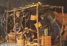 Load image into Gallery viewer, Viking-themed scene with people around a wooden structure, likely a market or trading area.