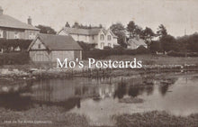 Load image into Gallery viewer, Vintage black and white photo of a village scene with houses and a pond, featuring 'Mo's Postcards' text.
