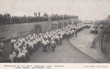 Load image into Gallery viewer, Vintage photograph of a military departure scene with people on a ship, likely from Jersey in 1904.