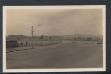 Load image into Gallery viewer, Unknown Location Postcard - Road Crossing With Chimneys in Distance RS10285
