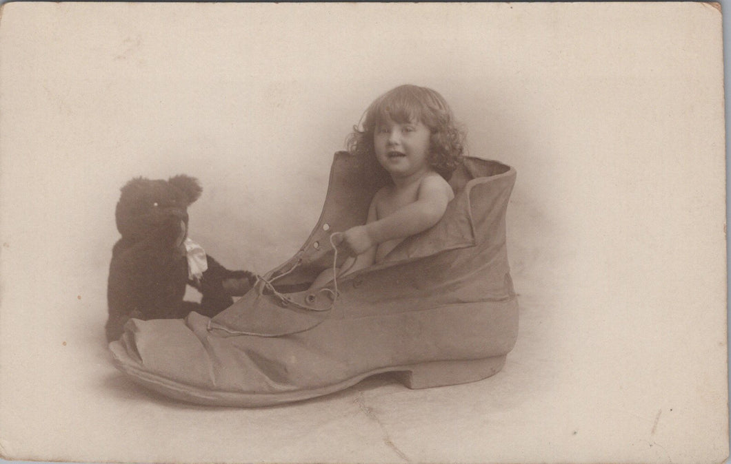 Children Postcard - Young Child Sat inside a Boot  SW16140