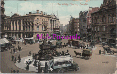 Vintage postcard of Piccadilly Circus, London with people and vehicles around a statue.