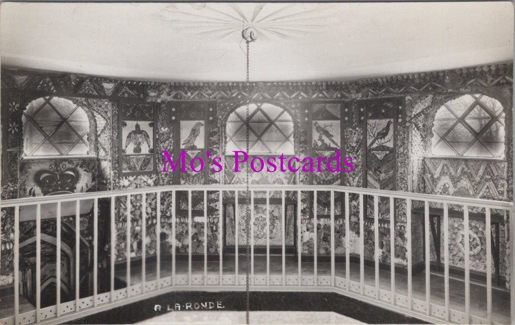 Decorative interior with intricate wall patterns and a railing, featuring 'Mo's Postcards' text.