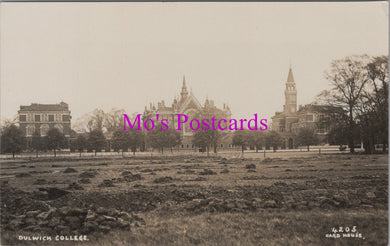 Vintage black and white photo of a large building with 'Mo's Postcards' text overlay