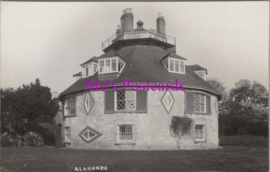 Vintage black and white photograph of a hexagonal house with 'Mo's Postcards' text overlay.