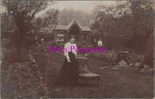 Load image into Gallery viewer, Ancestors Postcard - Lady Posing Next to a Chair in a Garden  SW14879
