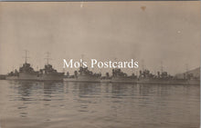 Load image into Gallery viewer, Vintage black and white photograph of naval ships docked at a harbor 
