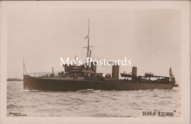 Vintage black and white postcard of a ship named 'HMS Thorn'  
