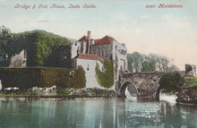 Load image into Gallery viewer, Vintage postcard of Leeds Castle with a bridge and gatehouse over water, near Maidstone.
