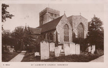 Load image into Gallery viewer, Vintage photograph of St Clement&#39;s Church in Sandwich, featuring a stone building with a clock tower and gravestones.
