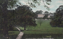 Load image into Gallery viewer, Vintage postcard of Calverley Park &amp; Hotel in Tunbridge Wells with trees and a path.
