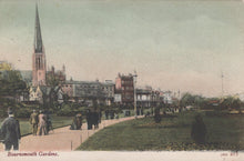 Load image into Gallery viewer, Vintage postcard of Bournemouth Gardens with a church spire and people walking.
