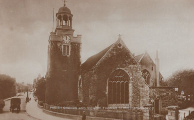 Vintage black and white photograph of a church with a clock tower.