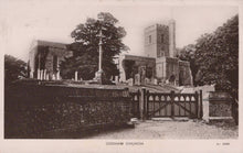 Load image into Gallery viewer, Vintage black and white photograph of a church with a gate and trees in the background

