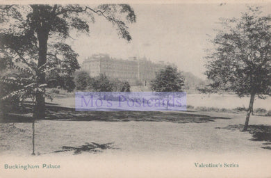 Vintage postcard of Buckingham Palace with trees and a lake