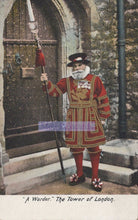 Load image into Gallery viewer, Man in a red and gold costume holding a staff, standing in front of a stone archway.
