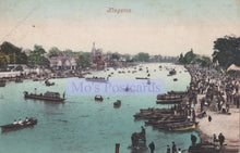 Load image into Gallery viewer, Vintage postcard of a bustling waterfront scene with boats and people, likely from the early 20th century.
