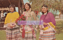 Load image into Gallery viewer, Three women in traditional attire standing outdoors with a &#39;Mo&#39;s Postcards&#39; logo overlay.
