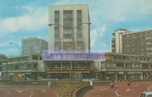 Load image into Gallery viewer, Urban scene with modern buildings and a clear sky, featuring &#39;Mo&#39;s Postcards&#39; watermark.
