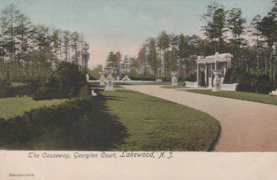 Vintage postcard of a garden scene with statues and pathways, labeled 'The Causeway, Georgian Court, Lakewood, N.J.'