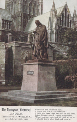 Statue of Alfred Tennyson in front of a cathedral with text at the bottom.